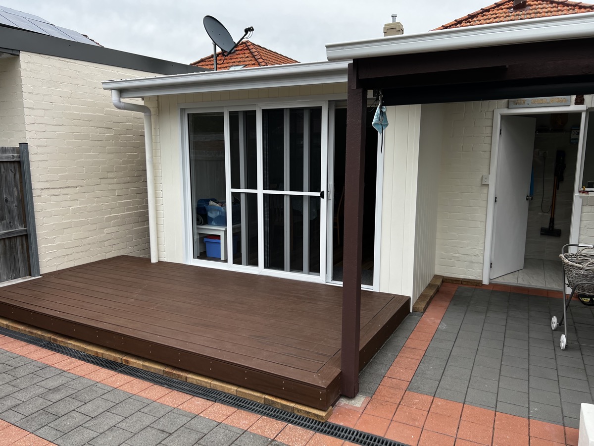 Modern wooden deck with a pergola